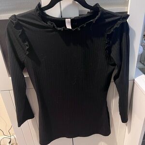 Black top with ruffle detailing